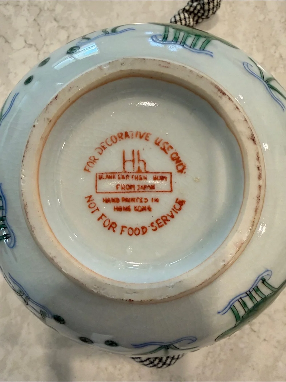 White Ceramic Bowl with Green Patterned Rim